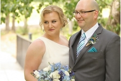 Alyssa-wedding-day-updo-with-peacock-hairpiece-and-blue-and-grey-toned-eye-and-red-lip-wedding-day-makeup