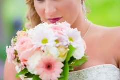 Brittany-bridals-with-braided-side-pony-hairstyle-and-smokey-eye-and-pink-toned-bridal-makeup