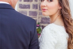 Kelseys-down-and-loosely-curled-wedding-day-hair-and-lighter-smokey-eye-with-pinky-nude-lip-wedding-day-makeup
